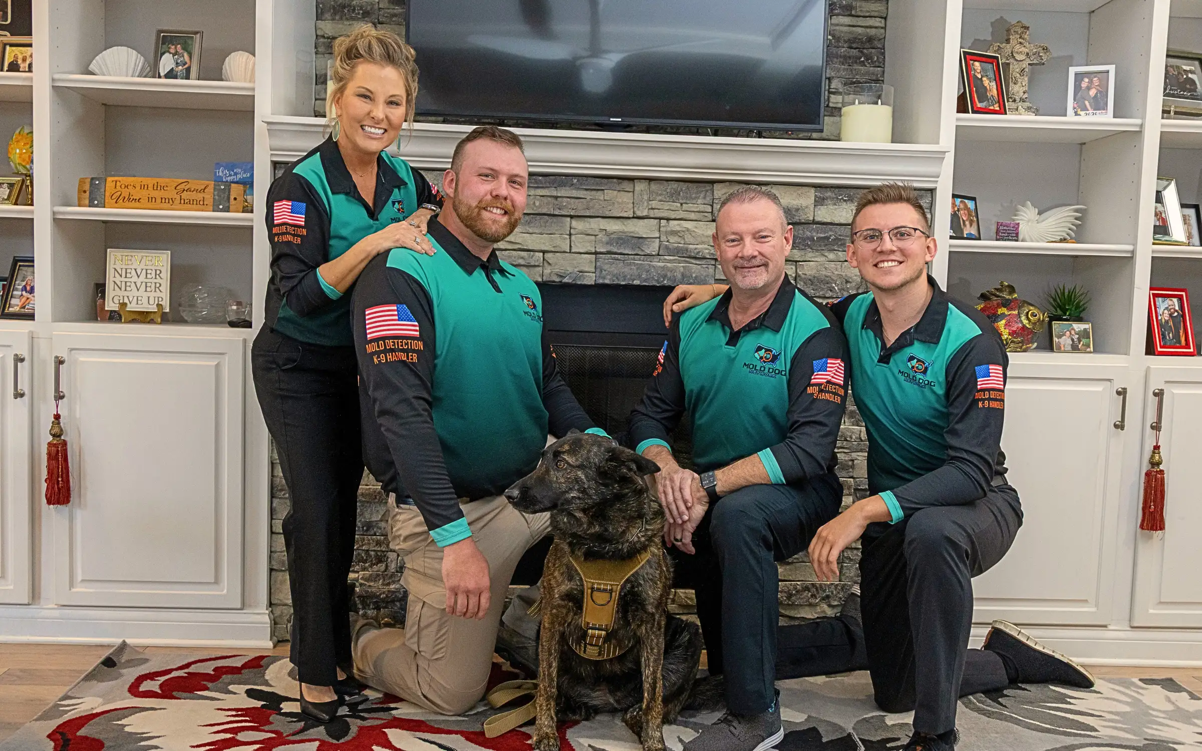 The mold dog network team with one of their mold dogs