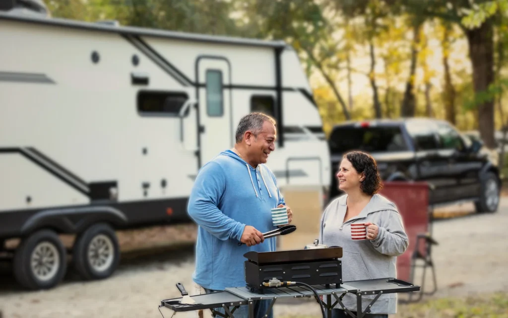 RV owners aving a BBQ outside their RV after a mold inspection